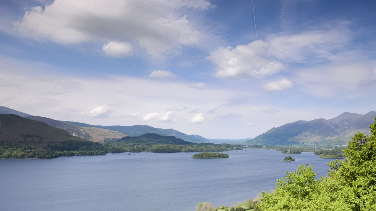 Lake District National park landscape timelapse. 4k time lapse at Derwentwater Lake in Cumbria, England on sunny day with clouds moving