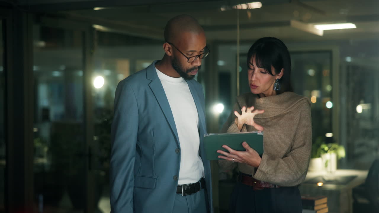 Business team discussing project on tablet