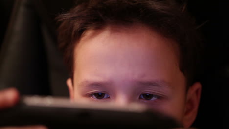 Teenager-is-playing-his-portable-game-console