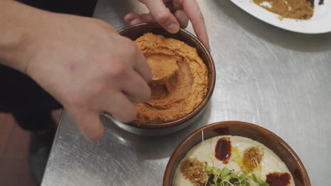 chef prepares mediterranean starter dish