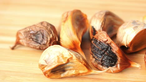 close up pf black garlic on white background table