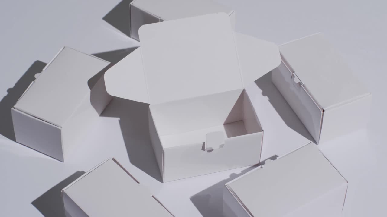 Video of cardboard boxes with copy space over white background