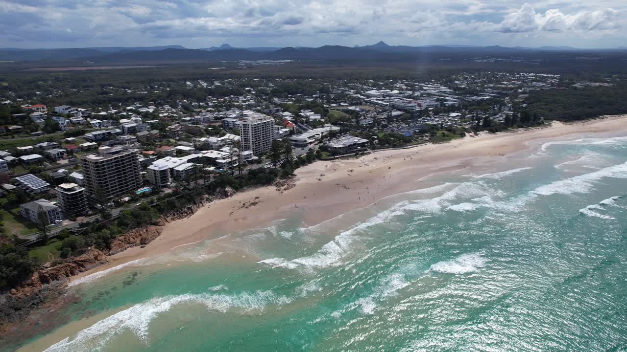White Sand Beach With Beachfront Hotels And Town In Coolum Beach, Sunshine Coast, QLD, Australia. - aerial shot