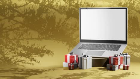 computadora portátil de la temporada navideña rodeada de regalos sobre fondo amarillo