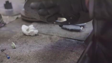 mechanic cleans brake discs