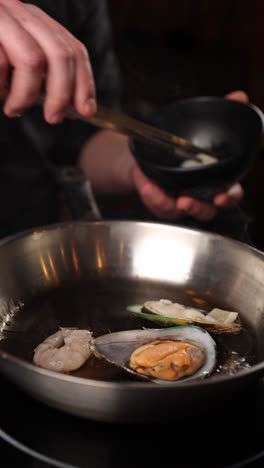 chef preparing a seafood dish