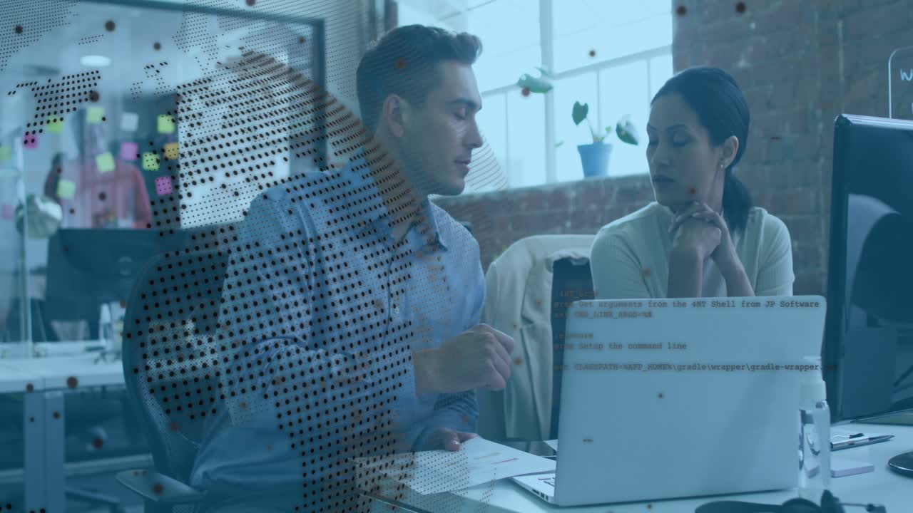 Man pointing printout and woman checking laptop in tech office sparking map overlay guiding choice