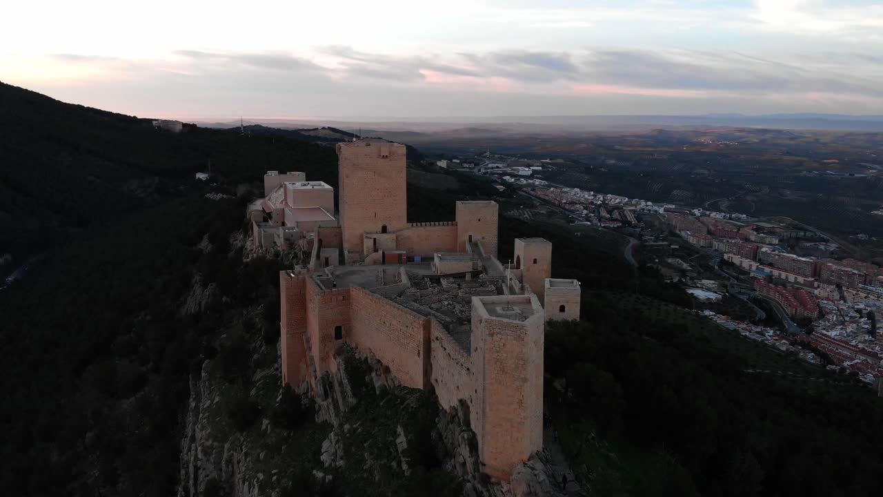 Jaen's Castle Saint Catalina Castle Spain shoot with a drone at 4k 24fps showing the exterior and the city from multiple points on a afternoon in December.