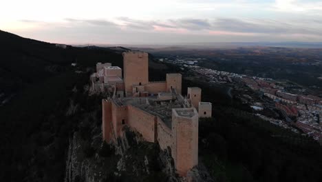 jaen's castle saint catalina castle spain shoot with a drone at 4k 24fps showing the exterior and the city from multiple points on a afternoon in december.