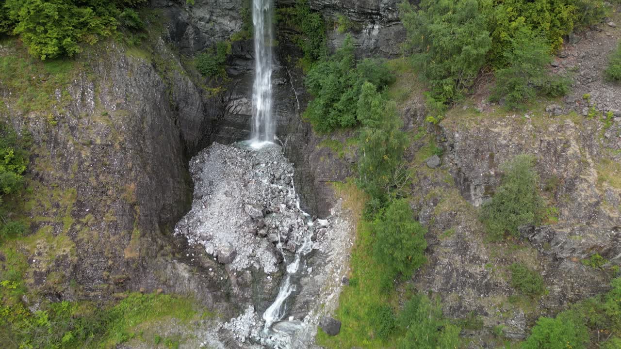 Done shot panning up a giant waterfall in the narrow Norwegian fjords