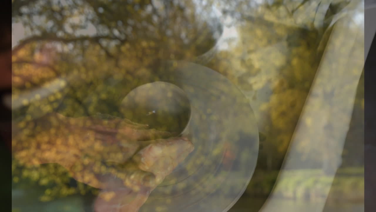 Shaping clay on pottery wheel, hands creating animation in outdoor setting