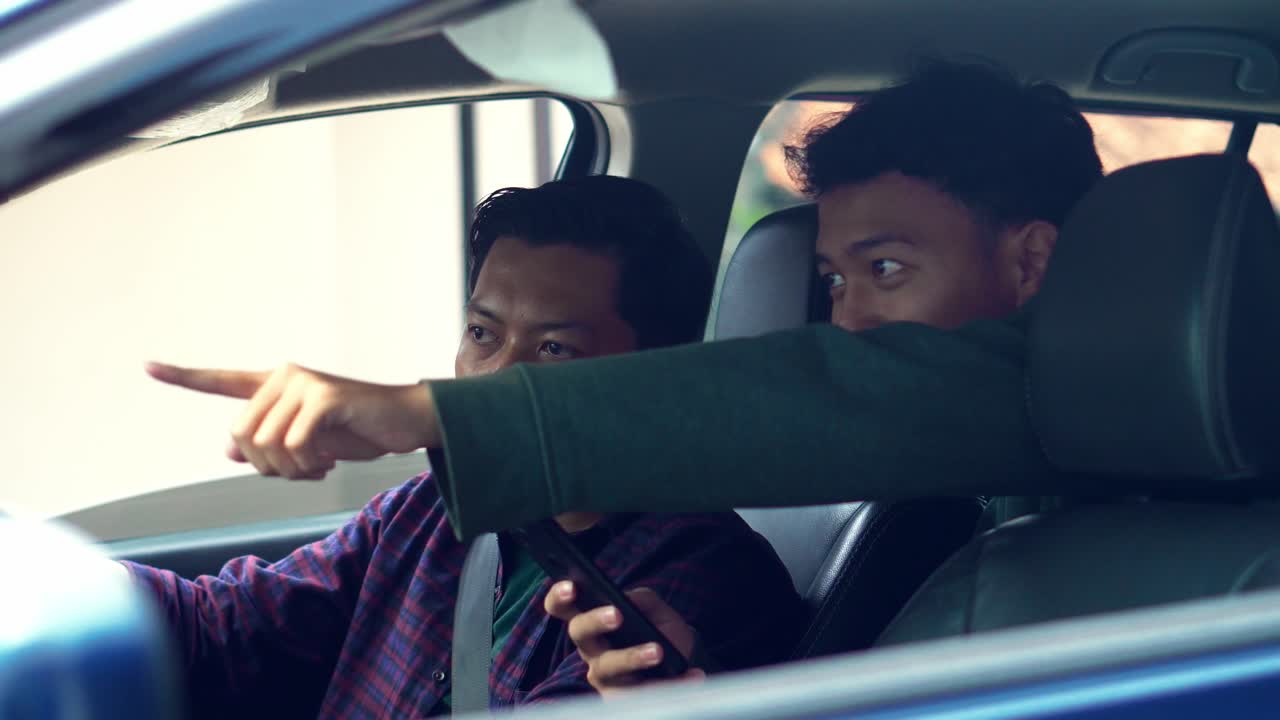 Driver Receiving Directions From His Passenger While Traveling