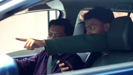 driver receiving directions from his passenger while traveling