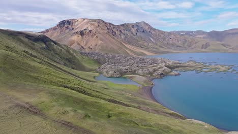 direct smooth drone approach to lava field in frostastaðavatn lake