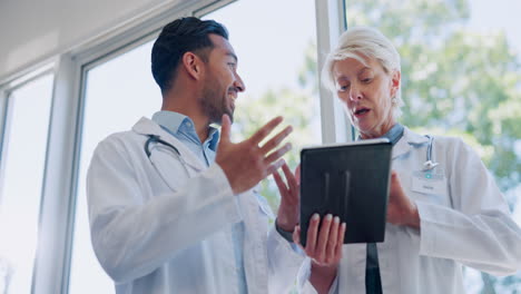 doctors, tablet and team discussion in hospital