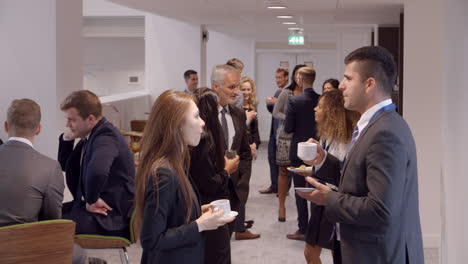 delegates networking during coffee break at conference