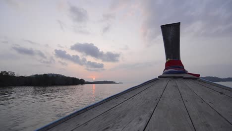 landscape of the head front of local boat while sailing in sea ocean in early morning time