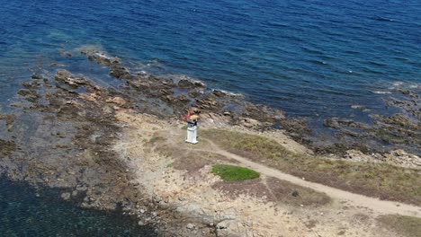 zoom out of a lifeguard watch tower on the coast