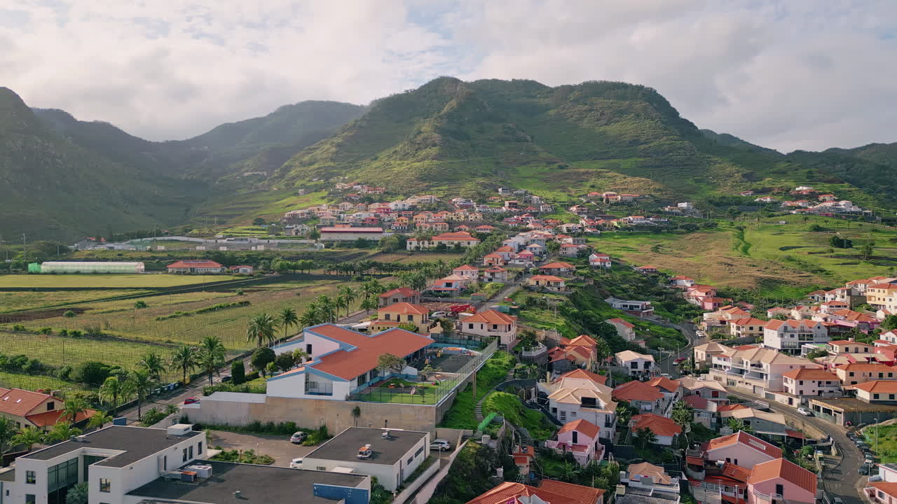 Drone picturesque village rooftops at mediterranean countryside. Shore town