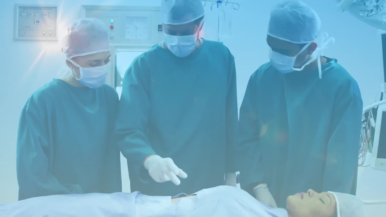 병원 에서 얼굴 마스크 를 착용 한 외과 의사 들 위 에 반 ⁇ 이는 빛 의 애니메이션