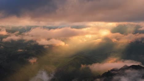 low clouds over a highland plateau in the rays of sunset. sunset on bermamyt plateau north caucasus, karachay-cherkessia, russia.