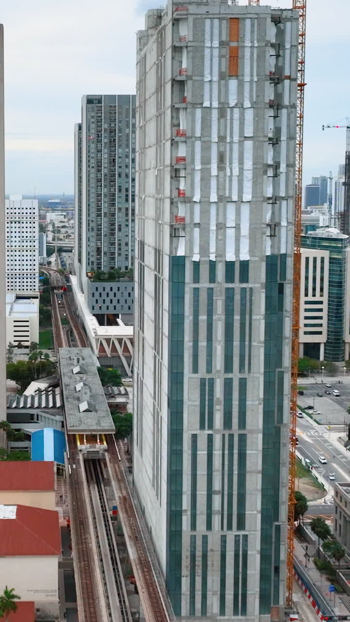 Downtown Miami with skyscrapers. Miami Metro Line. Vertical video