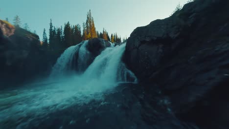 fpv drone flying towards a waterfall