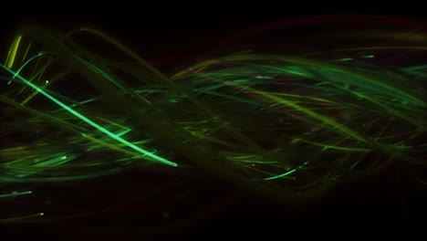 twisting bundle of green fibres moving across black background