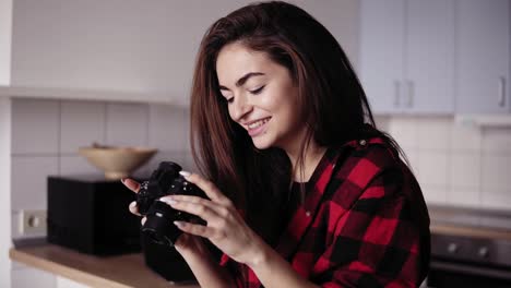 Close-up-footage-of-a-young-brunette-girl-looking-into-the-camera-and-laughing.