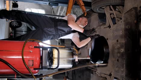 mechanic performing car maintenance at an auto repair shop