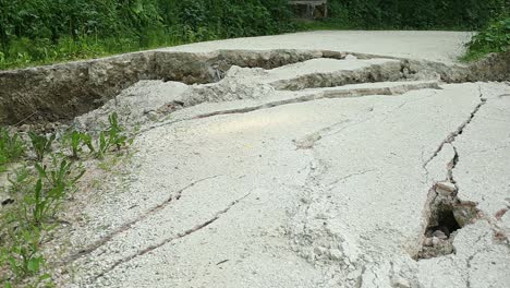 gravel road cracked by a landslide after a tropical storm in italy