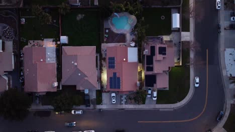 Car-Driving-Through-90º-Turn-in-Residential-Neighborhood-at-Dusk