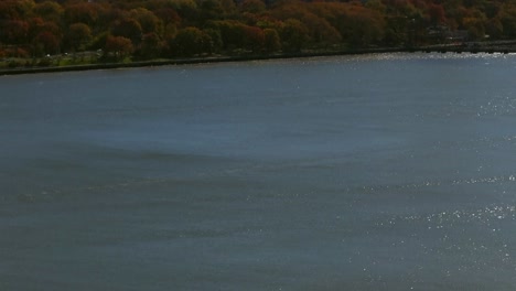 an aerial view over the hudson river on a sunny day in new york city