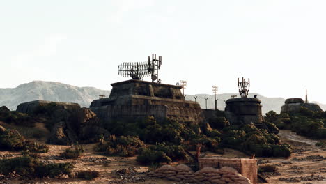 abandoned military base in the desert with radar antennas and radio towers