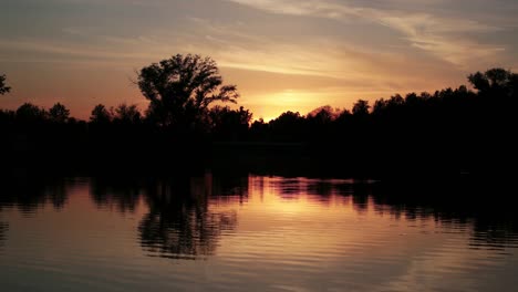 beautiful scenic sunset over the forest near the lake. timelapse.