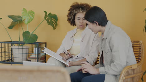 two people working or studying together in a relaxed setting.