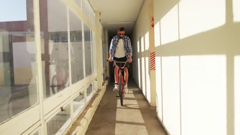 bmx rider in an empty warehouse