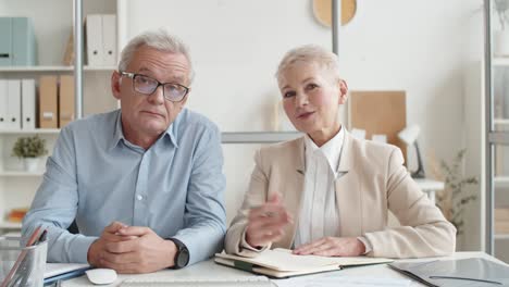 pov of caucasian man and woman participating in video call from office