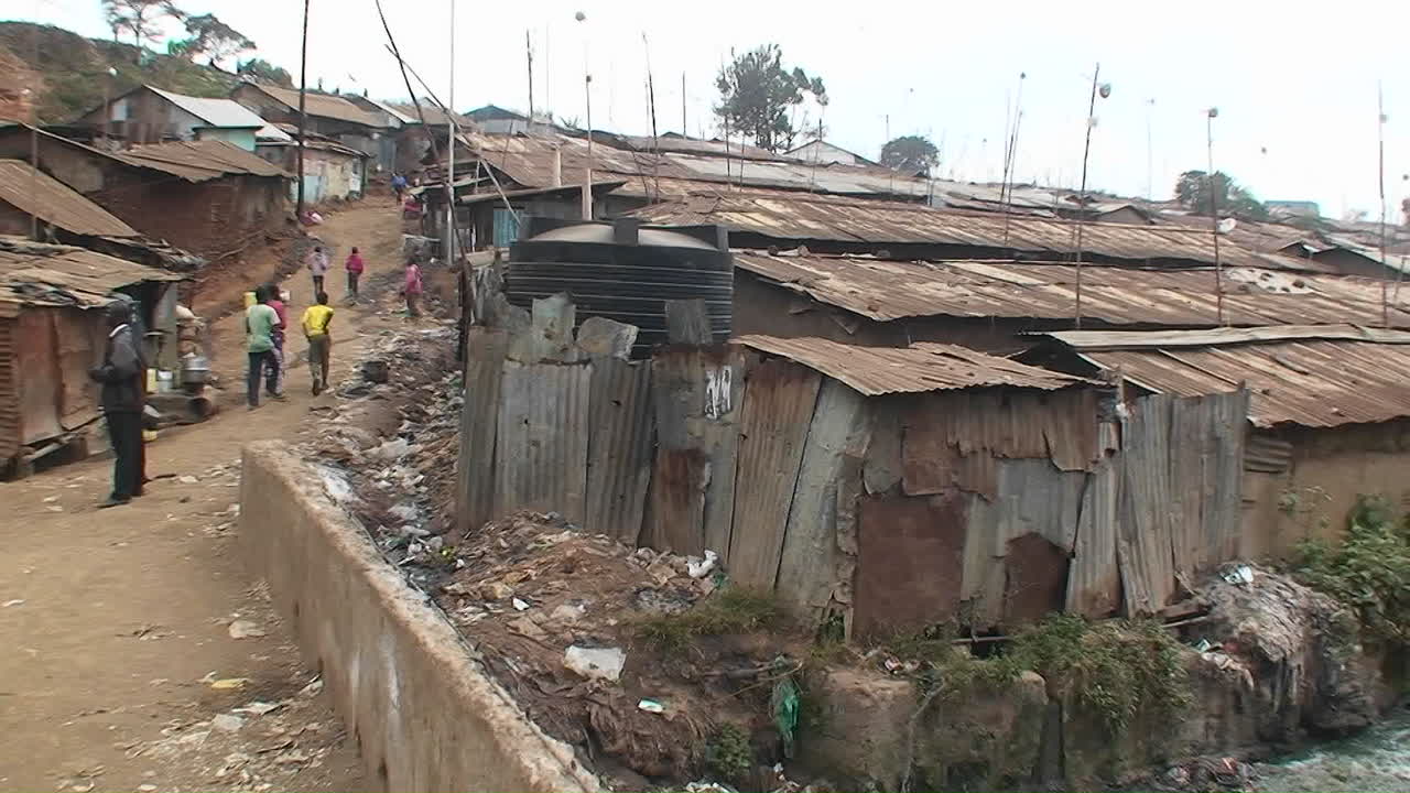 Premium stock video - Polluted water flowing in an unhealthy slum