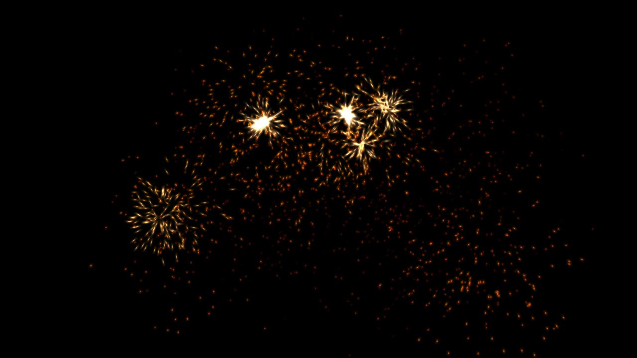 Scintille arancioni, gialle e rosse su sfondo nero. Effetto esplosione 4k