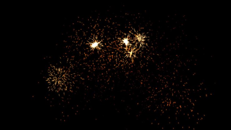 Scintille arancioni, gialle e rosse su sfondo nero. Effetto esplosione 4k