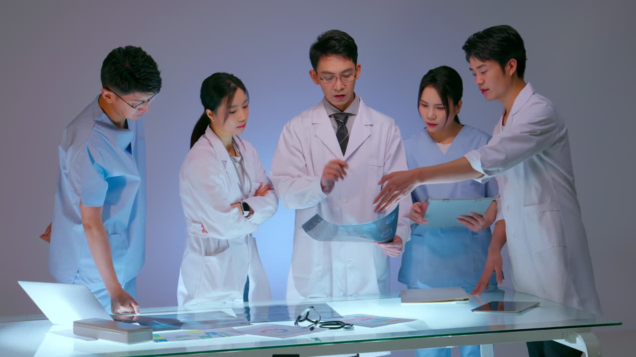 Healthcare, medical and radiology. Professional expert doctor talking with medical staff having meeting holding x-ray. Clinic therapist discussing with colleagues about disease