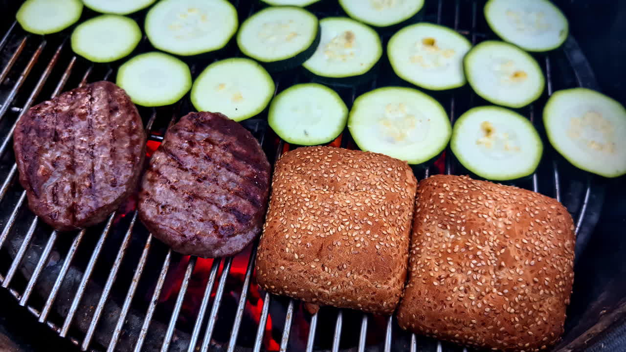 Slow motion tilt up angle, close up of vegetarian burger on grill - garden cooking