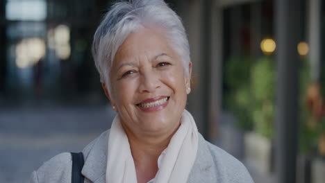 portrait-senior-indian-business-woman-laughing-enjoying-successful-lifestyle-stylish-mature-female-in-city-slow-motion-retirement-success