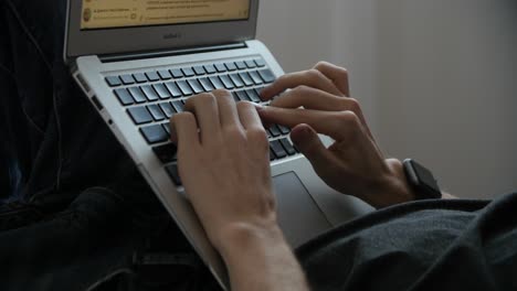 person typing on laptop