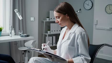 doctor writing notes in clinic