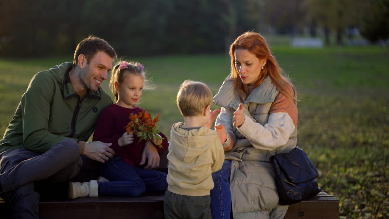 Family enjoying time together in the park during autumn