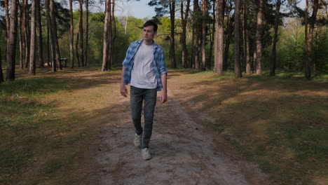 teenager walking in a forest