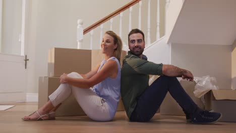 Caucasian-attractive-couple-moving-into-new-house