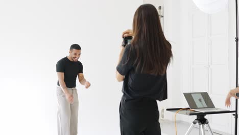 Photoshoot in a studio with a photographer and a male model